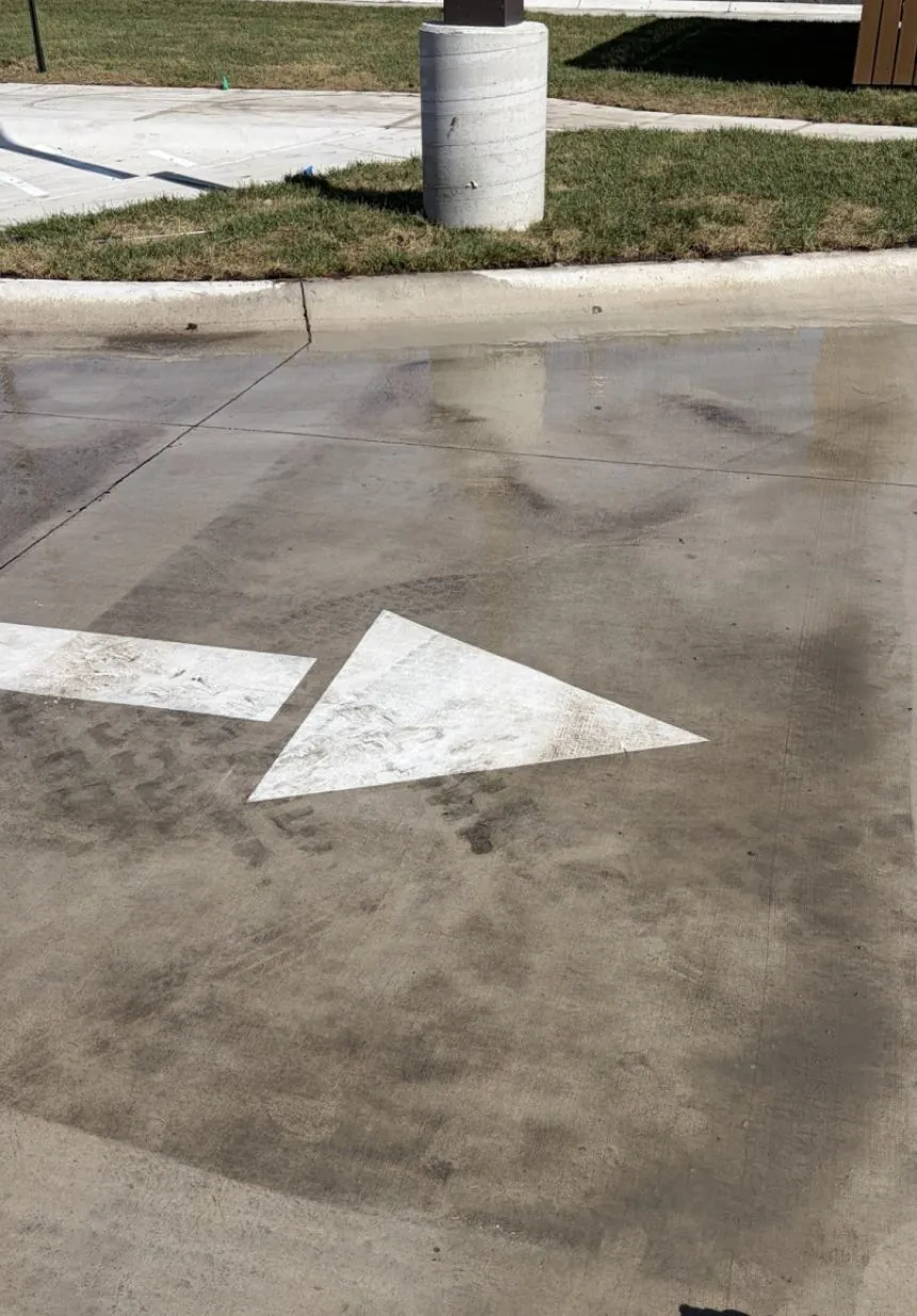 Parking lot concrete before pressure washing