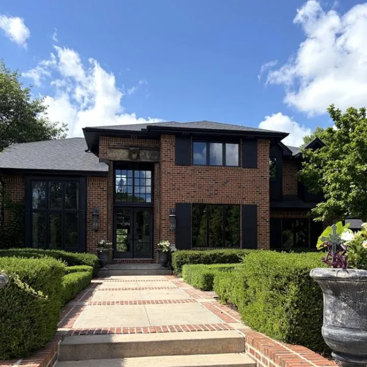 A brick home front with clean windows