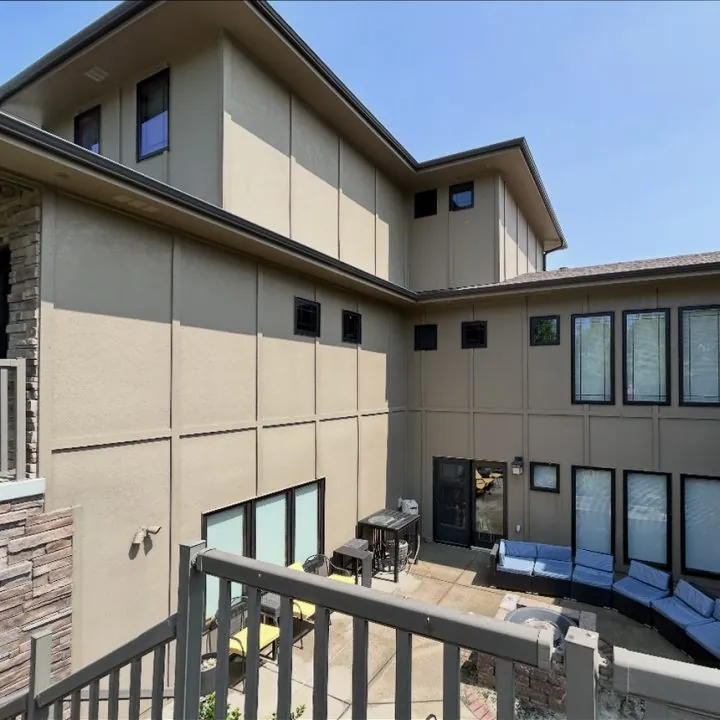 A tan stucco home's courtyard with clean windows