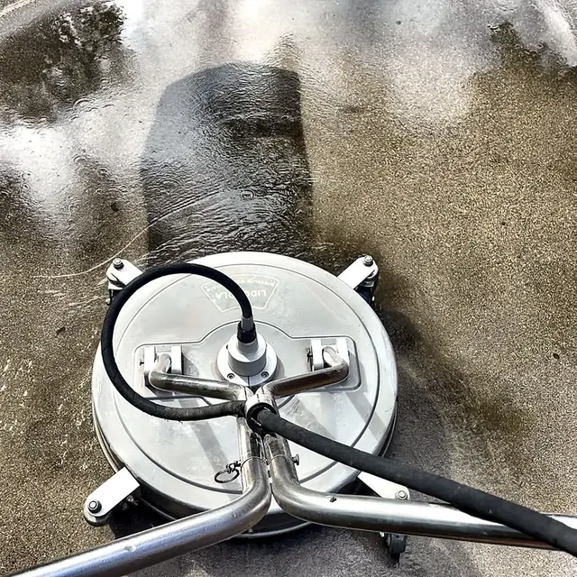 Surface cleaner cleaning a concrete patio